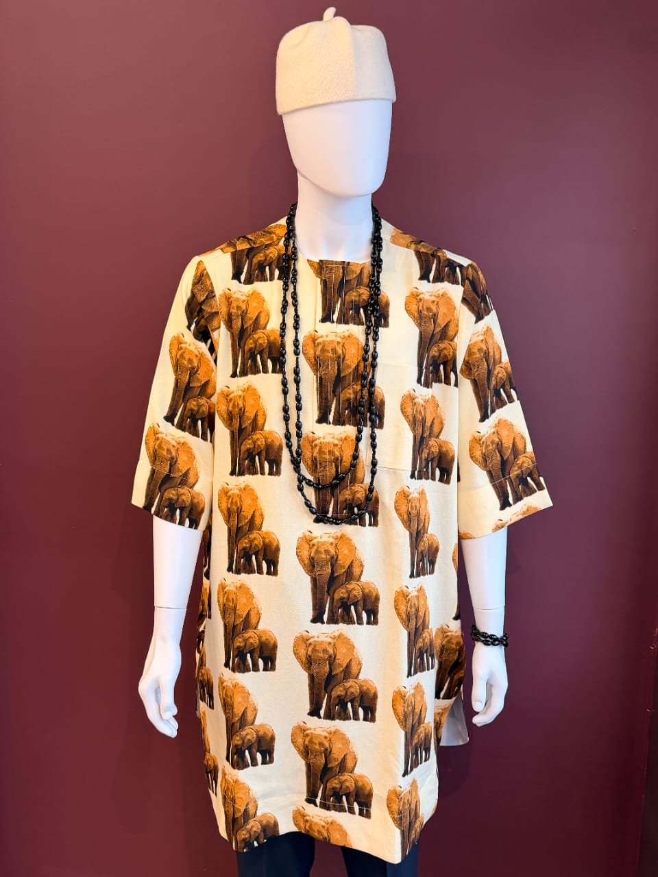 Ivory elephant print Isiagu shirt for men with African-inspired pattern and relaxed fit