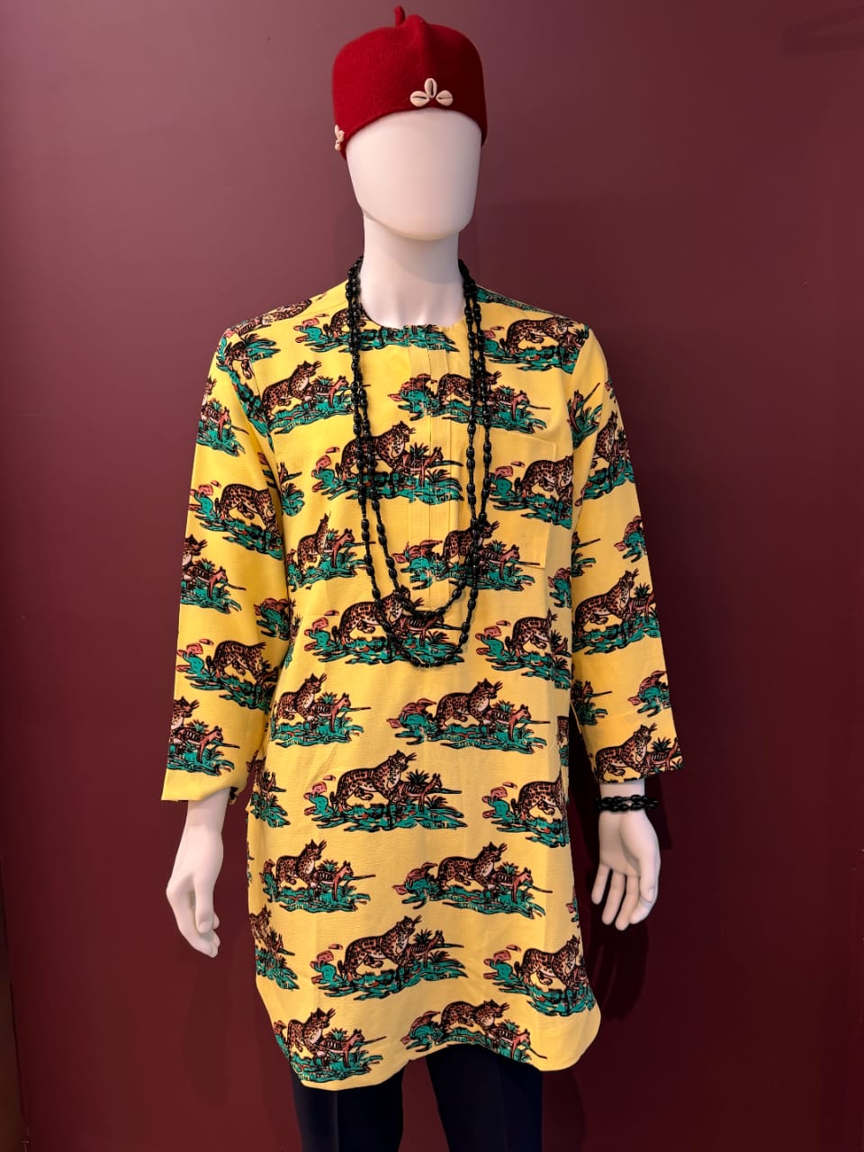 Yellow leopard print Isiagu tunic for men with colourful African-inspired pattern