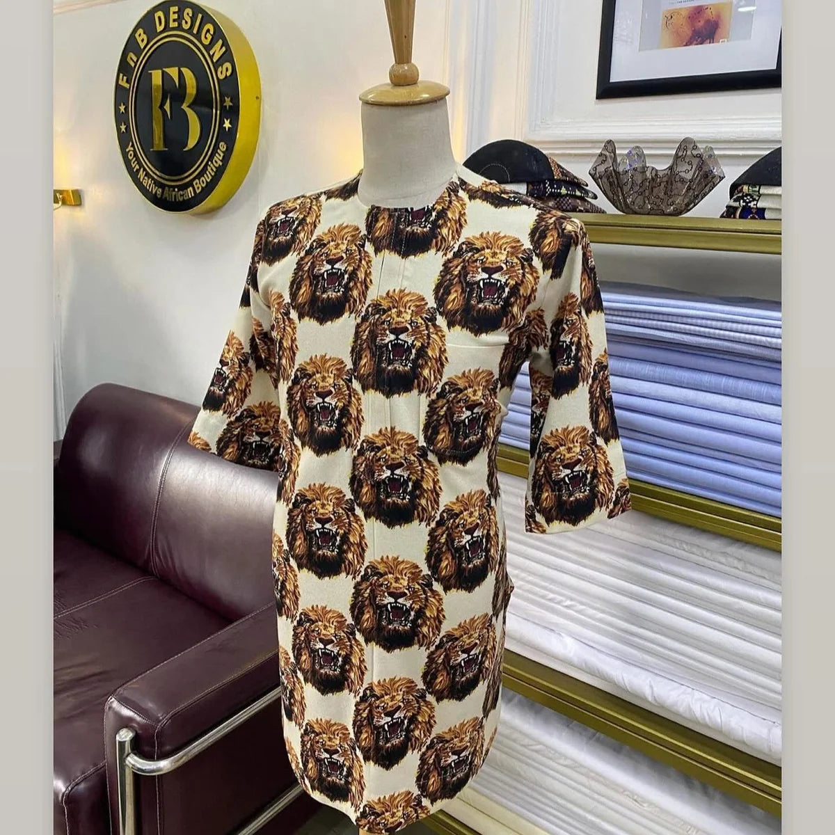 Cream long-sleeve Nigerian Isiagu featuring an all-over lion-head pattern
